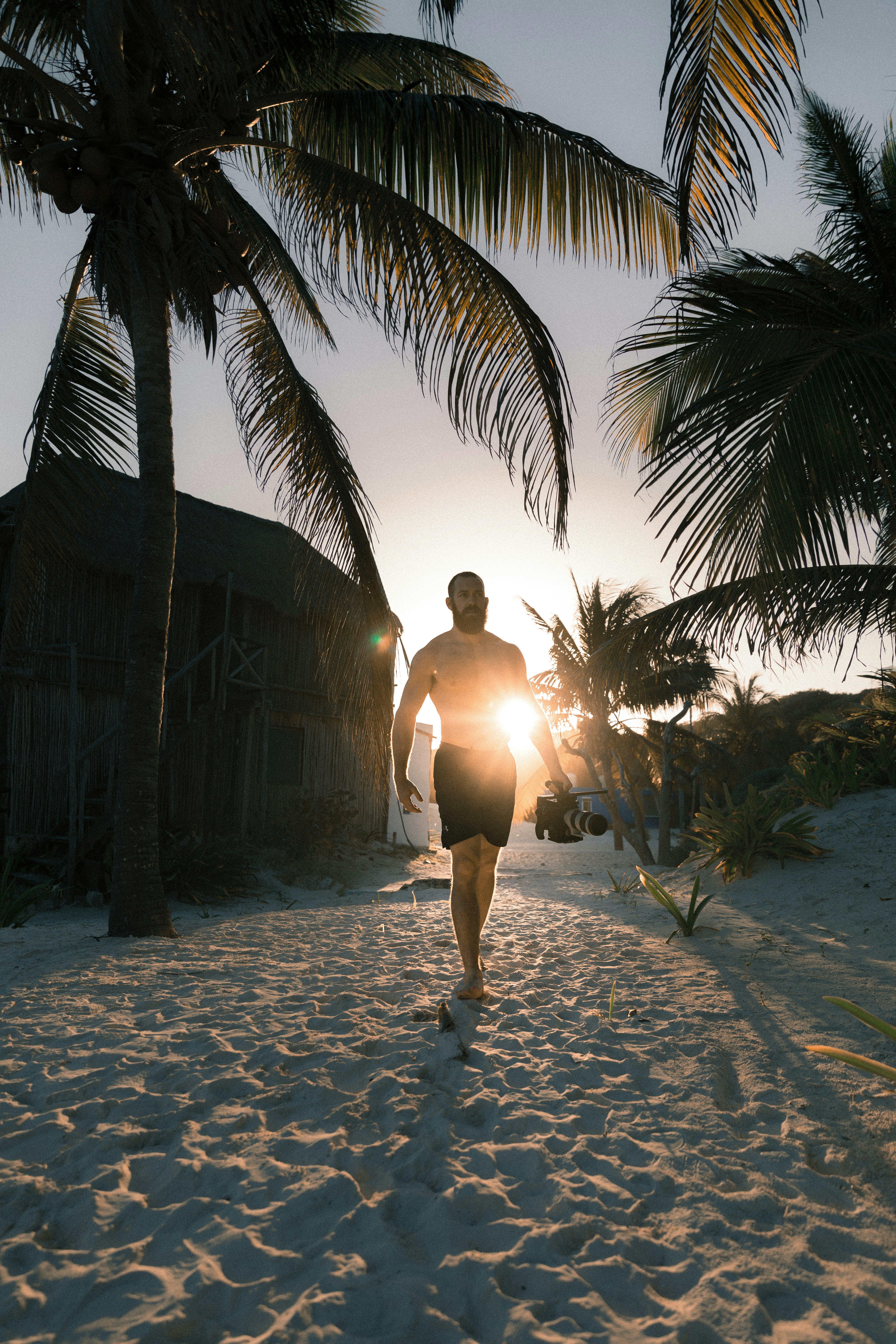 man walking on beach seashore